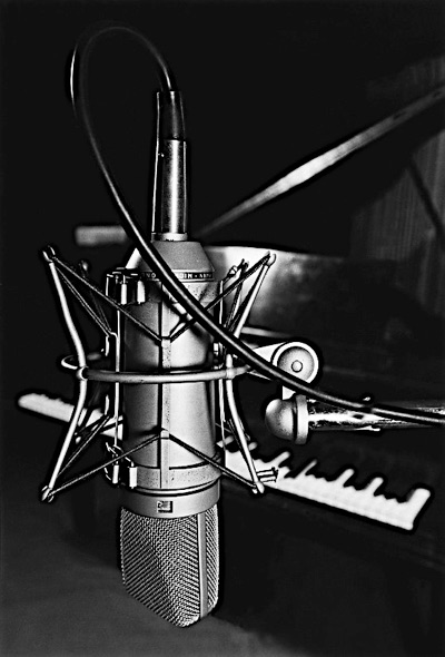 commercial editorial industrial photography microphone and piano in a recording studio